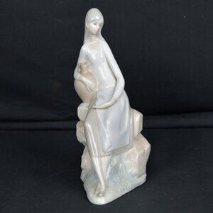 Nao by Lladro Girl Sitting on Rocks with  Water Jug Porcelain Figurine 10"